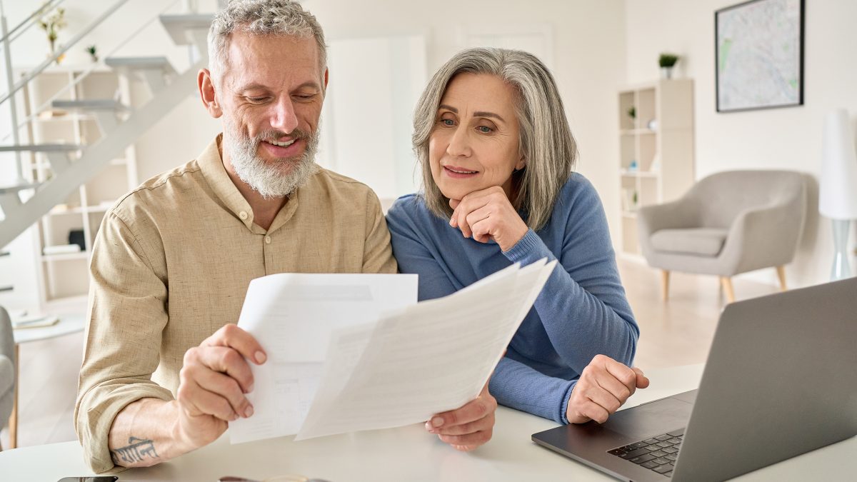 A couple looks over their retirement options. There are important differences between 403b, 457b, and 401k retirement plans.