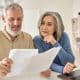 A couple looks over their retirement options. There are important differences between 403b, 457b, and 401k retirement plans.