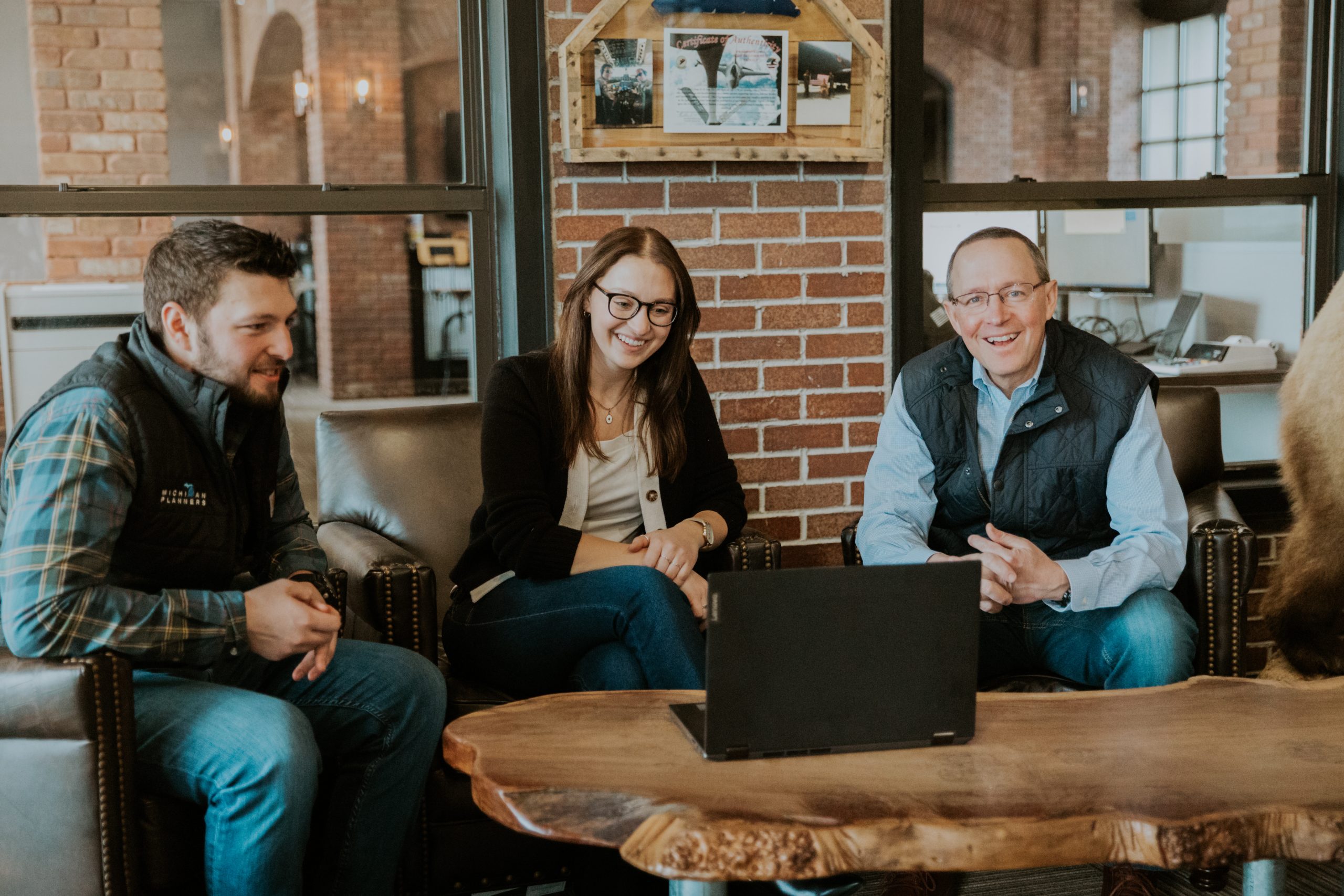 Members of the Michigan Planners team laugh together in the office